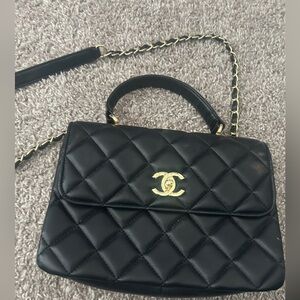 Great shape black with gold bag 
Can be worn crossbody and top handle .